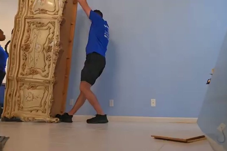 Standing an antique armoire in place